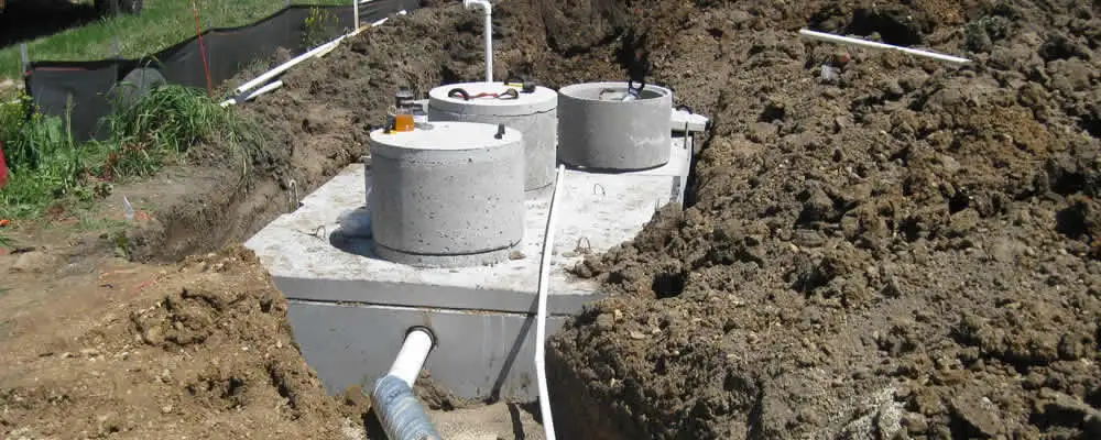 Septic system repair and installation site with tank access ports in Milwaukee, WI