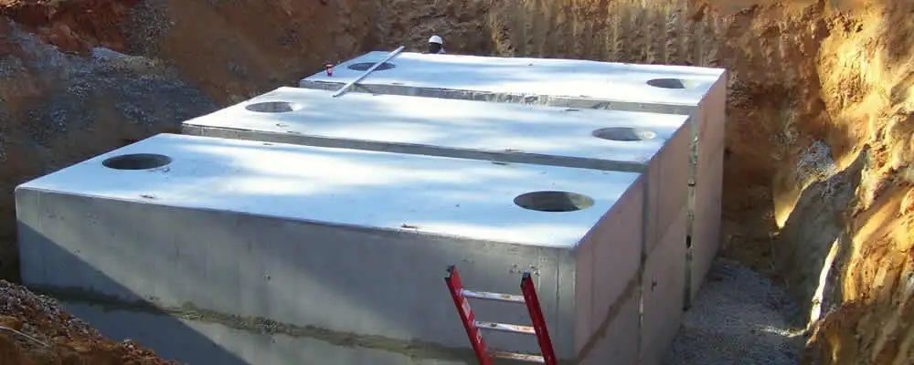 Septic tank installation site with a newly placed concrete tank in Milwaukee, WI